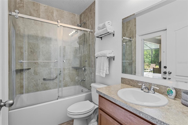full bathroom featuring vanity, toilet, and shower / bath combination with glass door