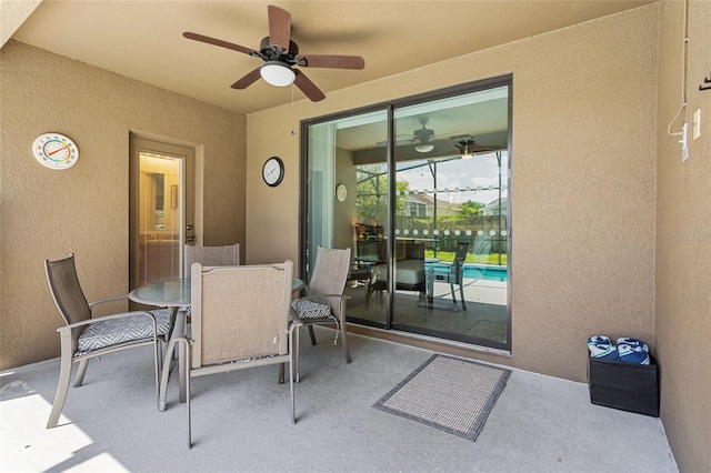 view of patio with ceiling fan and outdoor dining area