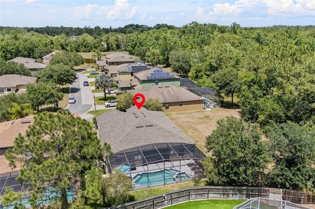 aerial view of a pool area and a forest