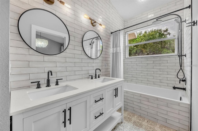 2287 Park Maitland Ct, Maitland, FL 32751 - full bathroom featuring a sink, double vanity, tile walls, and tiled shower / bath