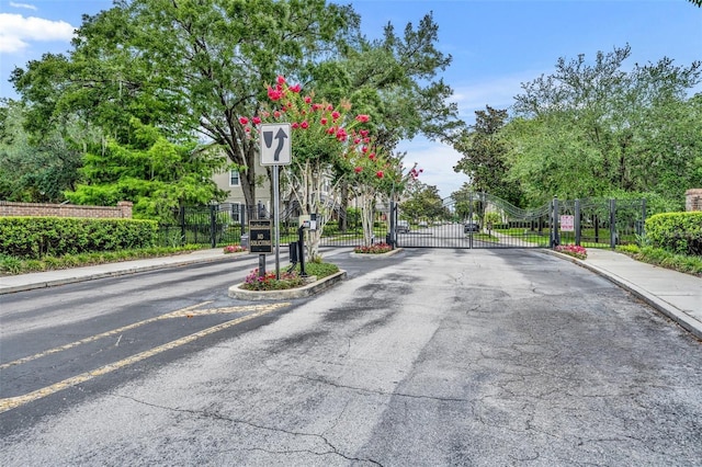 2287 Park Maitland Ct, Maitland, FL 32751 - view of road with curbs, sidewalks, a gated entry, and a gate