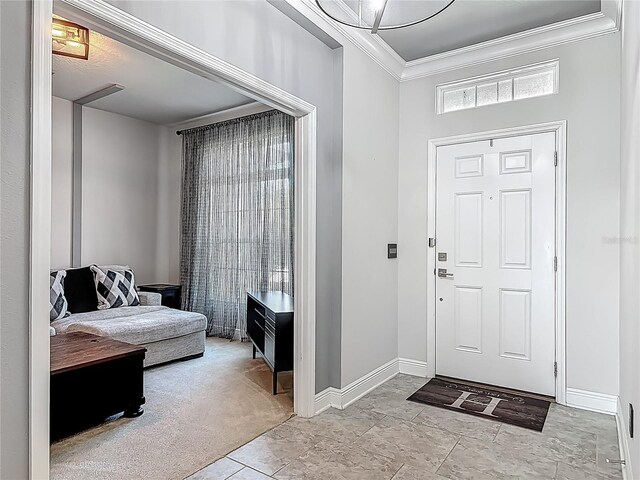 12313 Prairie Plantation Way, Orlando, FL 32824 - entrance foyer featuring ornamental molding, baseboards, and light carpet