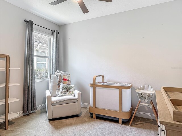 12313 Prairie Plantation Way, Orlando, FL 32824 - sitting room featuring ceiling fan, carpet floors, and baseboards