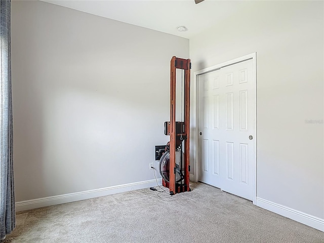 12313 Prairie Plantation Way, Orlando, FL 32824 - unfurnished bedroom featuring carpet floors, baseboards, and a closet