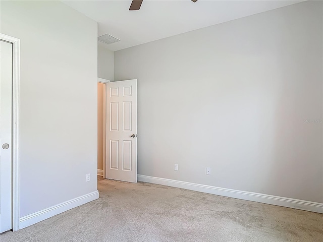 12313 Prairie Plantation Way, Orlando, FL 32824 - unfurnished bedroom with baseboards, light colored carpet, and a ceiling fan