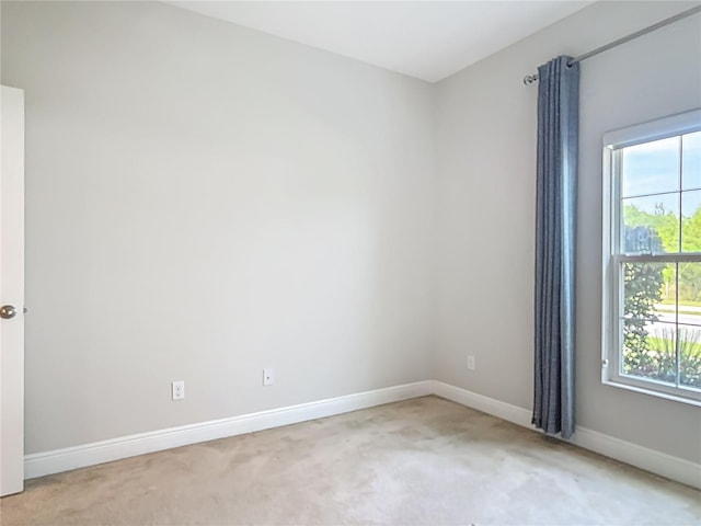 12313 Prairie Plantation Way, Orlando, FL 32824 - empty room with light carpet, healthy amount of natural light, and baseboards