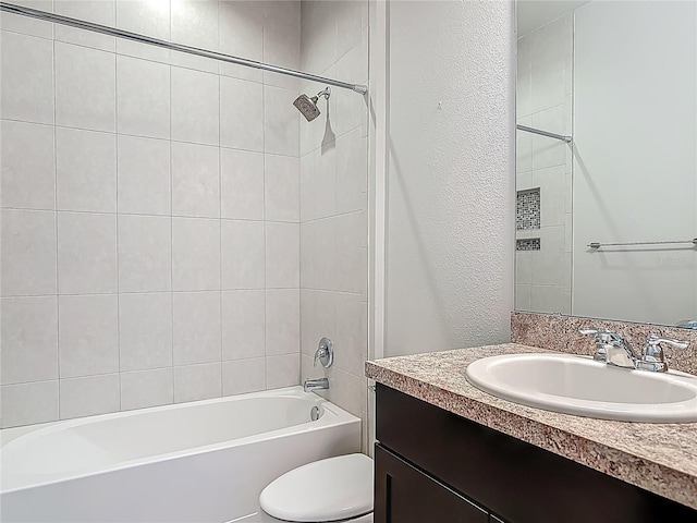 12313 Prairie Plantation Way, Orlando, FL 32824 - bathroom with vanity, toilet, a textured wall, and shower / bathtub combination