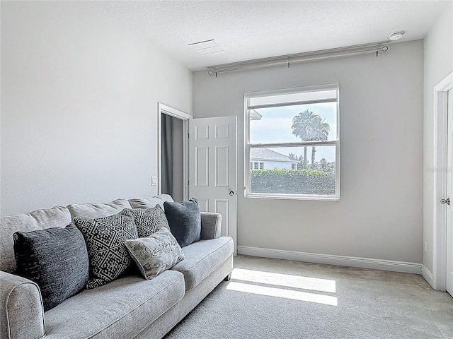 12313 Prairie Plantation Way, Orlando, FL 32824 - living room featuring baseboards and a textured ceiling