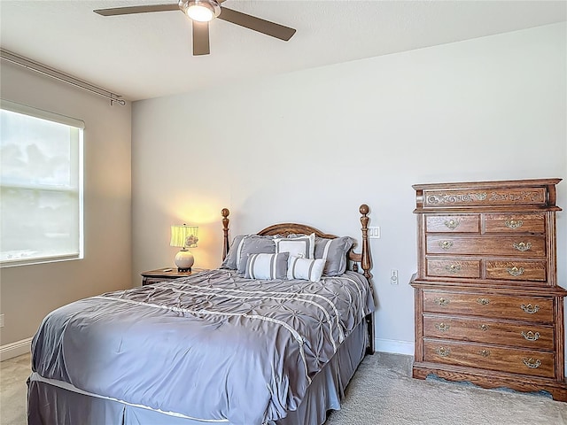 12313 Prairie Plantation Way, Orlando, FL 32824 - bedroom featuring light carpet, a ceiling fan, and baseboards