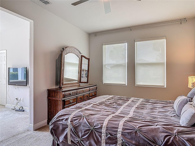 12313 Prairie Plantation Way, Orlando, FL 32824 - carpeted bedroom with baseboards and ceiling fan