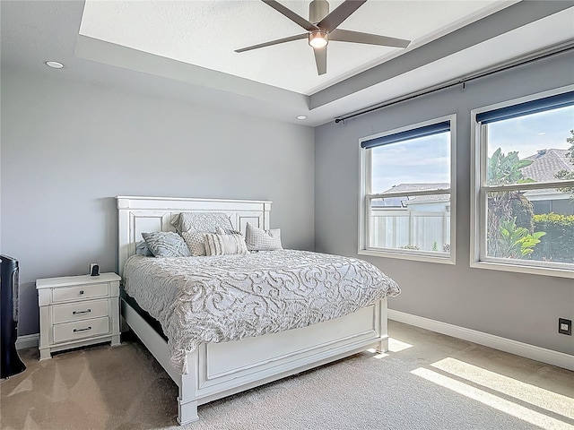 12313 Prairie Plantation Way, Orlando, FL 32824 - bedroom with carpet, baseboards, a tray ceiling, a ceiling fan, and recessed lighting