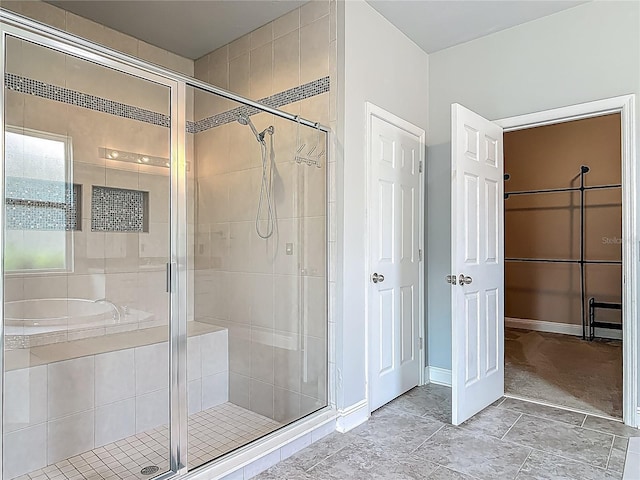 12313 Prairie Plantation Way, Orlando, FL 32824 - full bath with a stall shower, a garden tub, and baseboards