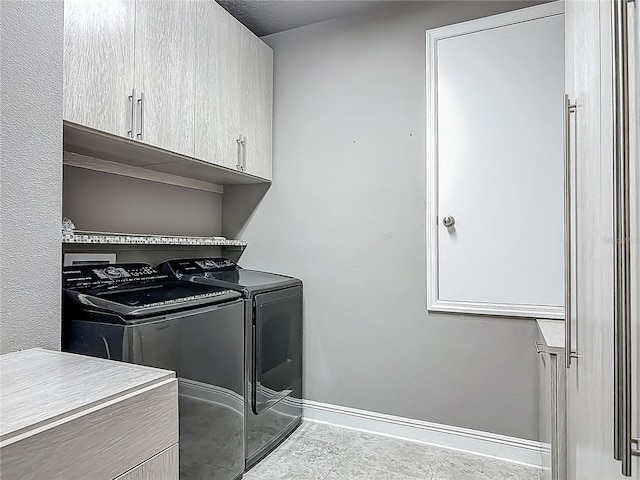 12313 Prairie Plantation Way, Orlando, FL 32824 - washroom with cabinet space, washing machine and clothes dryer, and baseboards