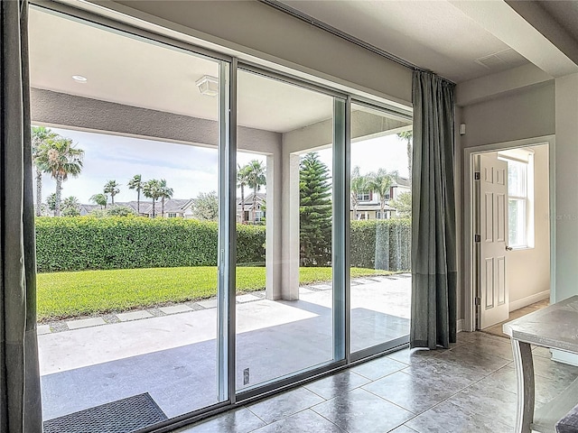 12313 Prairie Plantation Way, Orlando, FL 32824 - doorway to outside with tile patterned floors