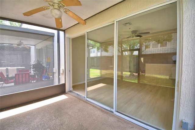 3151 Sinclair St Unit 104, Orlando, FL 32835 - unfurnished sunroom with a ceiling fan and healthy amount of natural light
