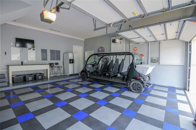 202 Acadia Ter, Kissimmee, FL 34747 - garage featuring white fridge with ice dispenser, a garage door opener, and electric panel