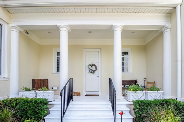 202 Acadia Ter, Kissimmee, FL 34747 - entrance to property featuring stucco siding and covered porch