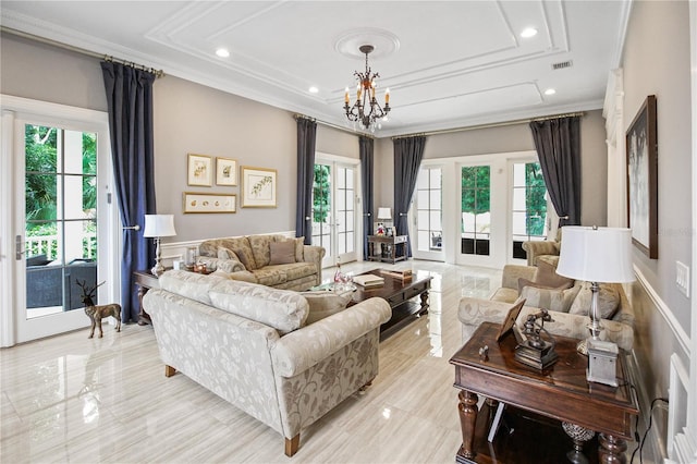 202 Acadia Ter, Kissimmee, FL 34747 - living area featuring crown molding, plenty of natural light, a chandelier, a wainscoted wall, and a tray ceiling