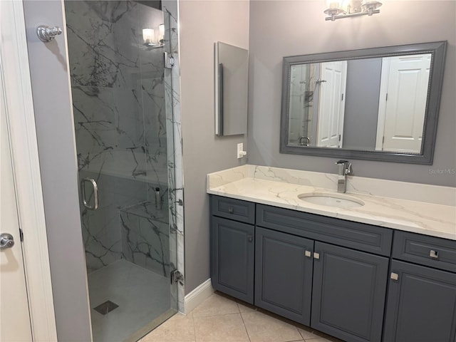 202 Acadia Ter, Kissimmee, FL 34747 - bathroom with a marble finish shower, vanity, and tile patterned floors