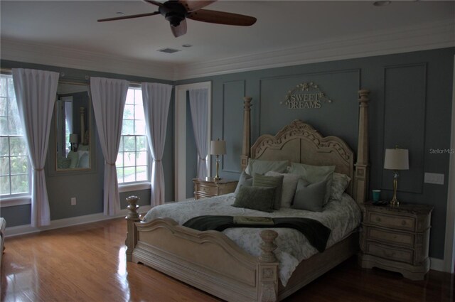 202 Acadia Ter, Kissimmee, FL 34747 - bedroom with ornamental molding, baseboards, wood finished floors, and ceiling fan
