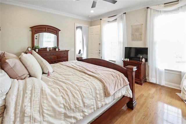 202 Acadia Ter, Kissimmee, FL 34747 - bedroom featuring light wood-type flooring, crown molding, recessed lighting, a ceiling fan, and baseboards