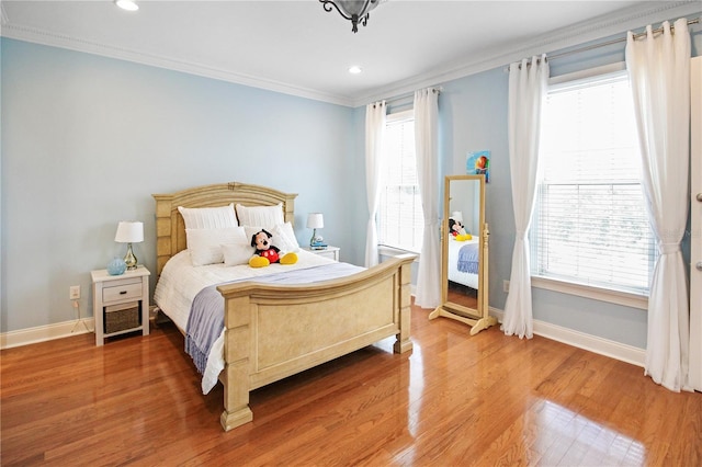 202 Acadia Ter, Kissimmee, FL 34747 - bedroom with baseboards, ornamental molding, multiple windows, light wood-type flooring, and recessed lighting