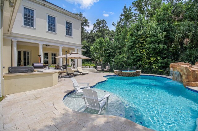 202 Acadia Ter, Kissimmee, FL 34747 - view of pool with a patio area and a pool with connected hot tub