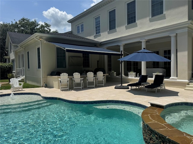 202 Acadia Ter, Kissimmee, FL 34747 - view of pool with a patio, a pool with connected hot tub, and a ceiling fan