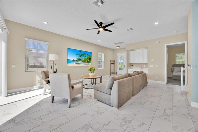 1428 Reunion Blvd, Kissimmee, FL 34747 - living area with light marble finish floors, baseboards, a ceiling fan, and recessed lighting