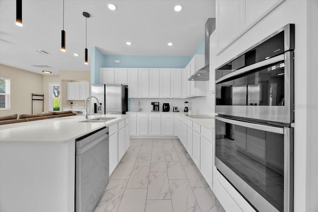 1428 Reunion Blvd, Kissimmee, FL 34747 - kitchen featuring stainless steel appliances, a sink, light marble finish floors, wall chimney exhaust hood, and white cabinetry