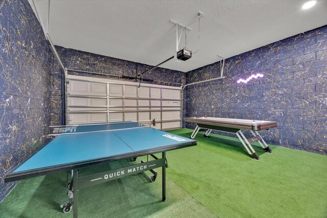 1428 Reunion Blvd, Kissimmee, FL 34747 - playroom featuring carpet, a textured ceiling, and a garage