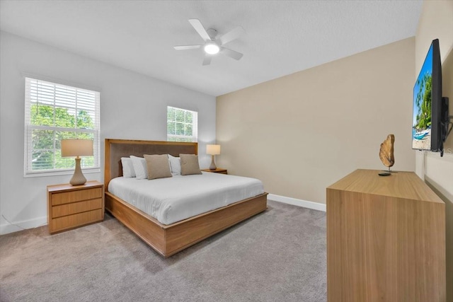 1428 Reunion Blvd, Kissimmee, FL 34747 - bedroom with light colored carpet, baseboards, and ceiling fan