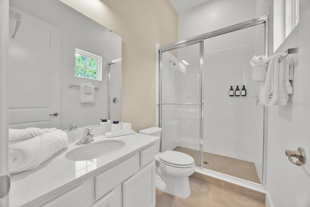 1428 Reunion Blvd, Kissimmee, FL 34747 - bathroom featuring tile patterned flooring, a stall shower, vanity, and toilet