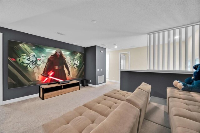 1428 Reunion Blvd, Kissimmee, FL 34747 - home theater with carpet, baseboards, and a textured ceiling