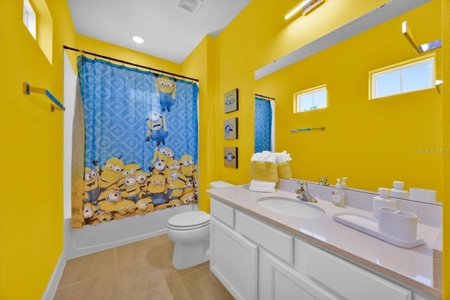 1428 Reunion Blvd, Kissimmee, FL 34747 - full bath with toilet, tile patterned floors, vanity, and shower / bath combo