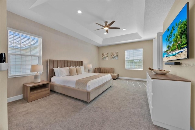 1428 Reunion Blvd, Kissimmee, FL 34747 - bedroom featuring carpet flooring, baseboards, a tray ceiling, recessed lighting, and a ceiling fan