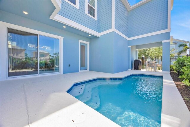 1428 Reunion Blvd, Kissimmee, FL 34747 - outdoor pool with a patio and fence