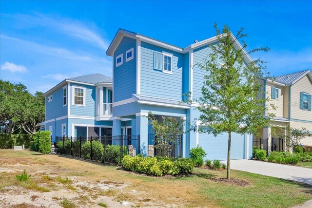 1428 Reunion Blvd, Kissimmee, FL 34747 - view of front of property featuring driveway, fence, metal roof, and a garage