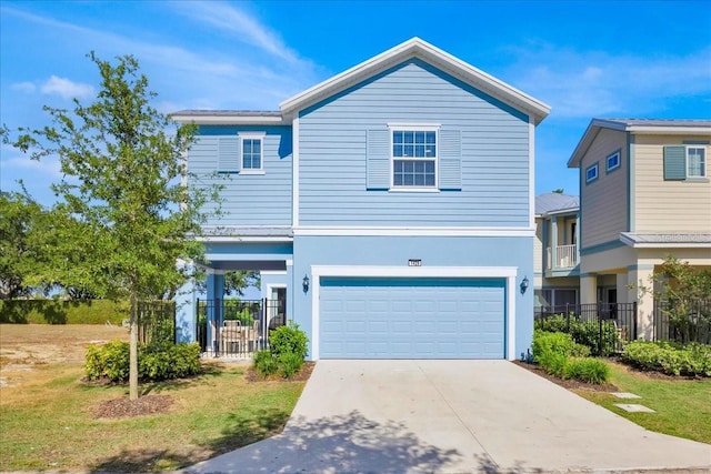 1428 Reunion Blvd, Kissimmee, FL 34747 - view of front of house featuring a garage, fence, and concrete driveway