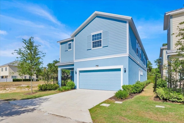 1428 Reunion Blvd, Kissimmee, FL 34747 - view of front of home featuring a garage, driveway, and stucco siding