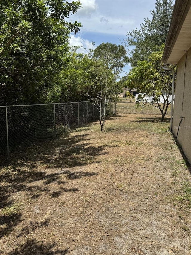 829 Anza Ave, Lehigh Acres, FL 33971 - view of yard with fence