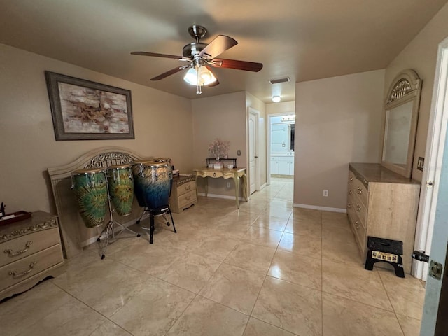 829 Anza Ave, Lehigh Acres, FL 33971 - bedroom featuring light tile patterned flooring, visible vents, a ceiling fan, connected bathroom, and baseboards
