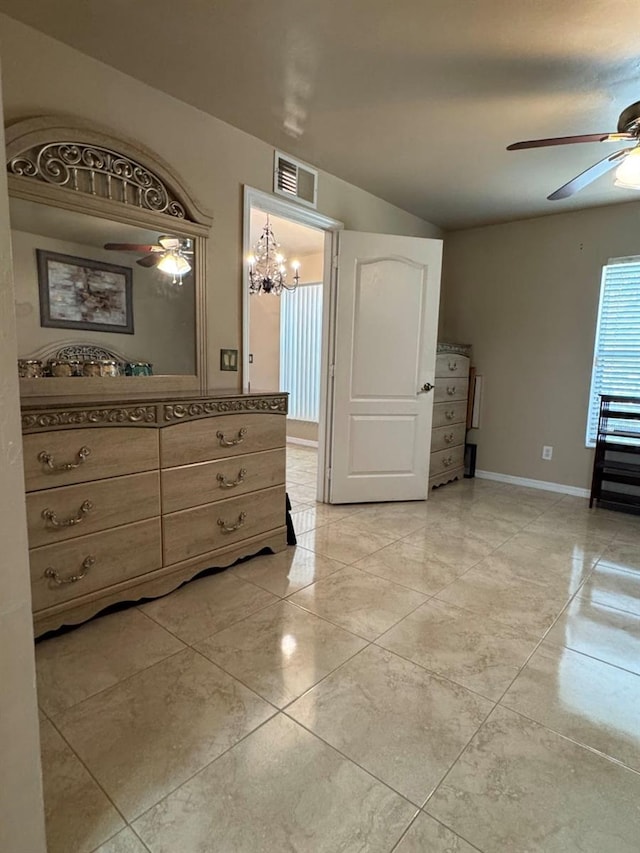829 Anza Ave, Lehigh Acres, FL 33971 - interior space with lofted ceiling, baseboards, visible vents, ceiling fan with notable chandelier, and vanity
