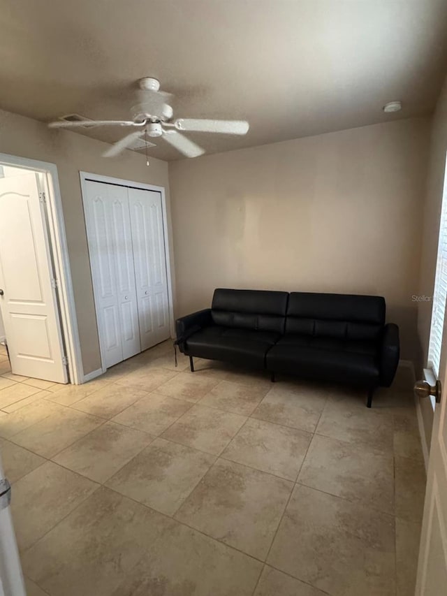 829 Anza Ave, Lehigh Acres, FL 33971 - living room featuring ceiling fan, baseboards, light tile patterned floors, and visible vents