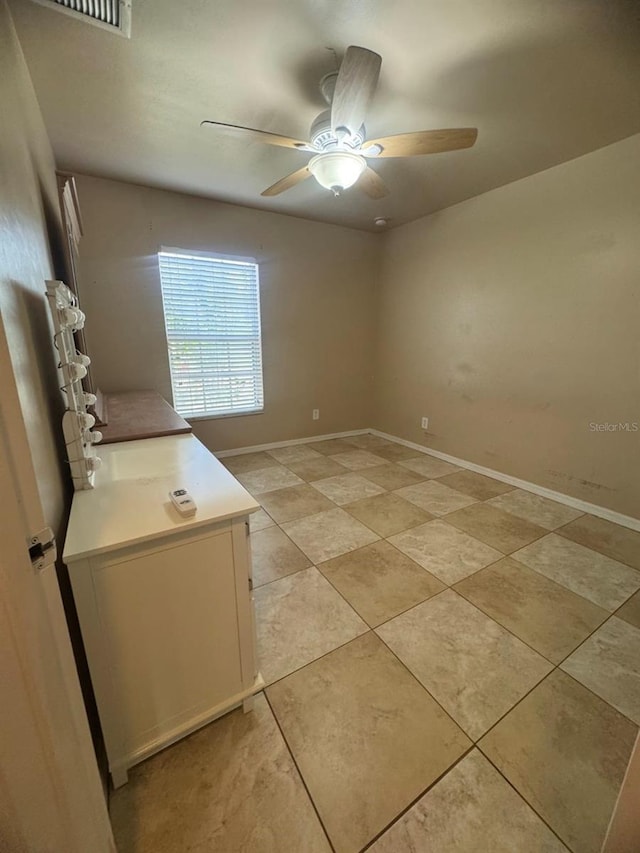829 Anza Ave, Lehigh Acres, FL 33971 - unfurnished room featuring ceiling fan, light tile patterned flooring, baseboards, and visible vents