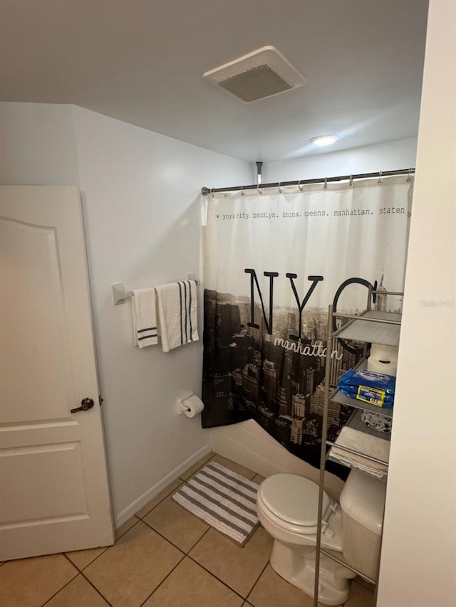 829 Anza Ave, Lehigh Acres, FL 33971 - full bath with toilet, tile patterned floors, curtained shower, visible vents, and baseboards