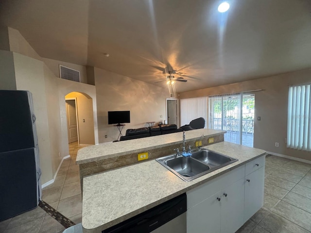 829 Anza Ave, Lehigh Acres, FL 33971 - kitchen featuring a sink, freestanding refrigerator, arched walkways, open floor plan, and stainless steel dishwasher
