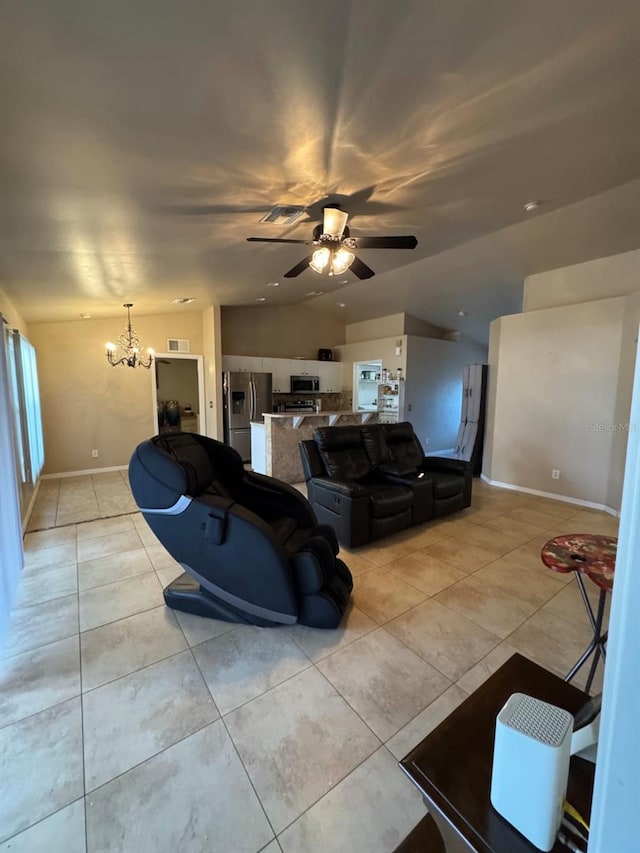 829 Anza Ave, Lehigh Acres, FL 33971 - living area with light tile patterned floors, ceiling fan with notable chandelier, visible vents, baseboards, and vaulted ceiling
