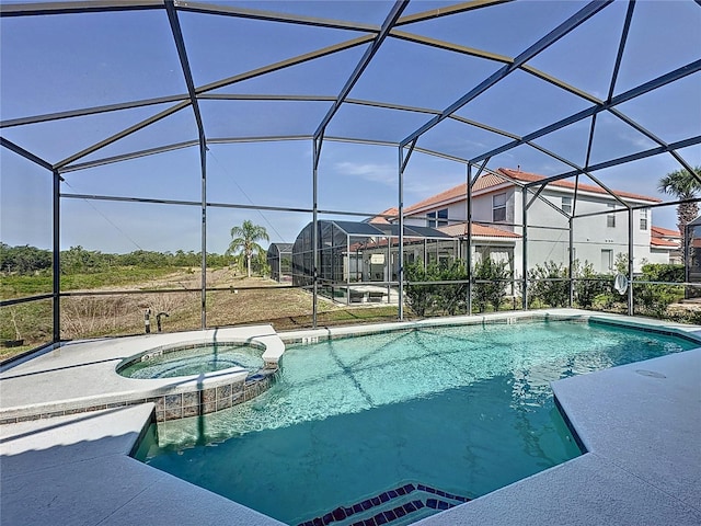 219 Rosso Dr, Davenport, FL 33837 - view of swimming pool with a pool with connected hot tub, glass enclosure, and a patio area