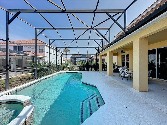 219 Rosso Dr, Davenport, FL 33837 - view of pool with a patio, ceiling fan, glass enclosure, and a pool with connected hot tub